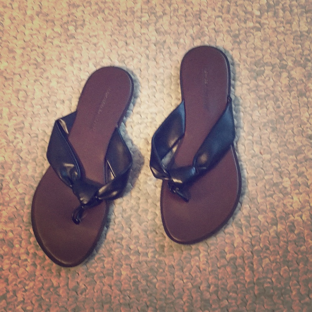 Black flat flip flops